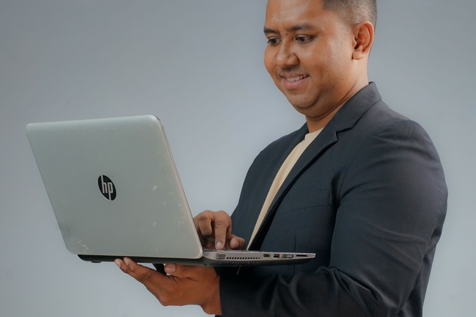 Business professional choosing between HP ProBook or EliteBook